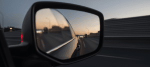 External car mirror merging onto the highway